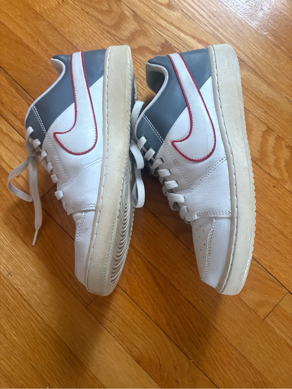 Nike White Gray Sneakers with Red Swoosh Accent